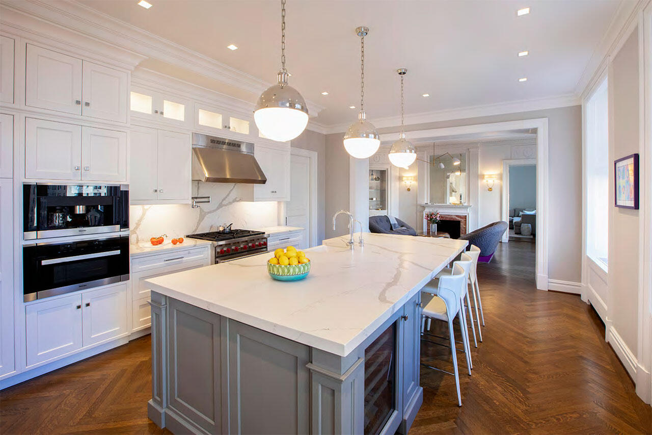 A white room with an Asian patterned separator made of wood