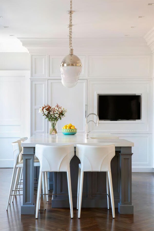 A white soaking bathtub in a brightly lit bathroom