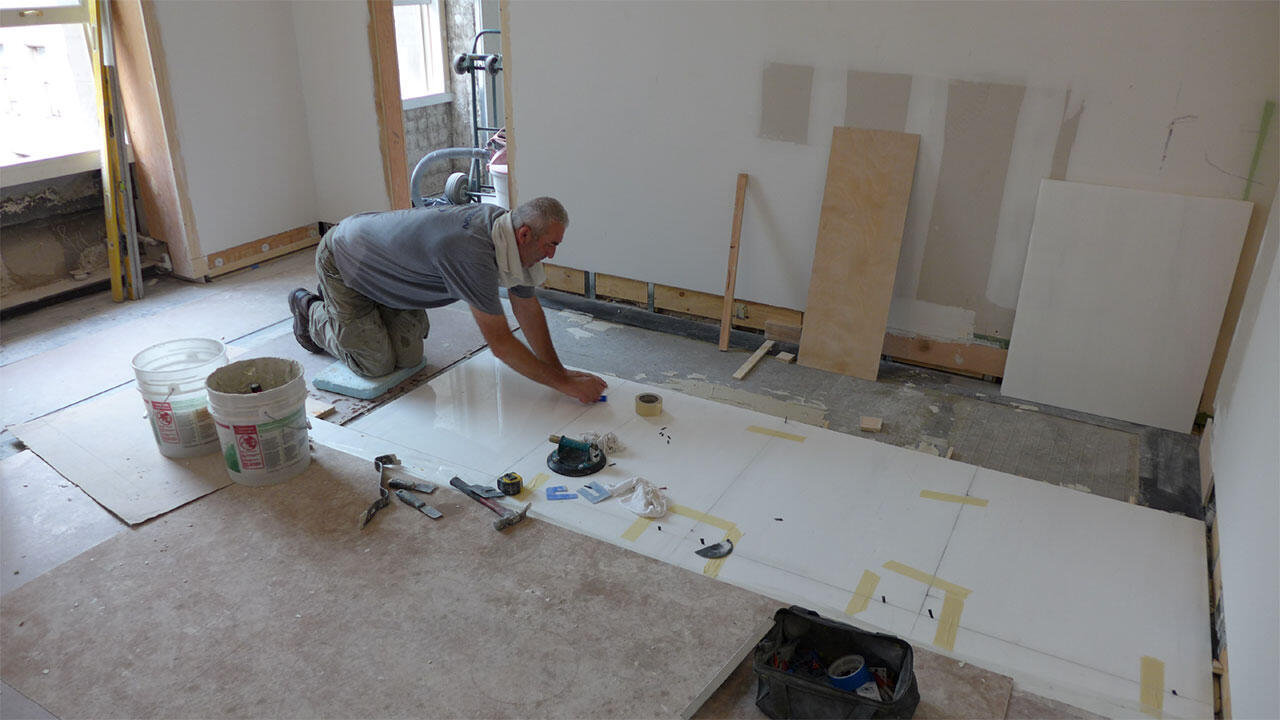 Brightly lit bathroom with 2 mirrors and a double vanity sink