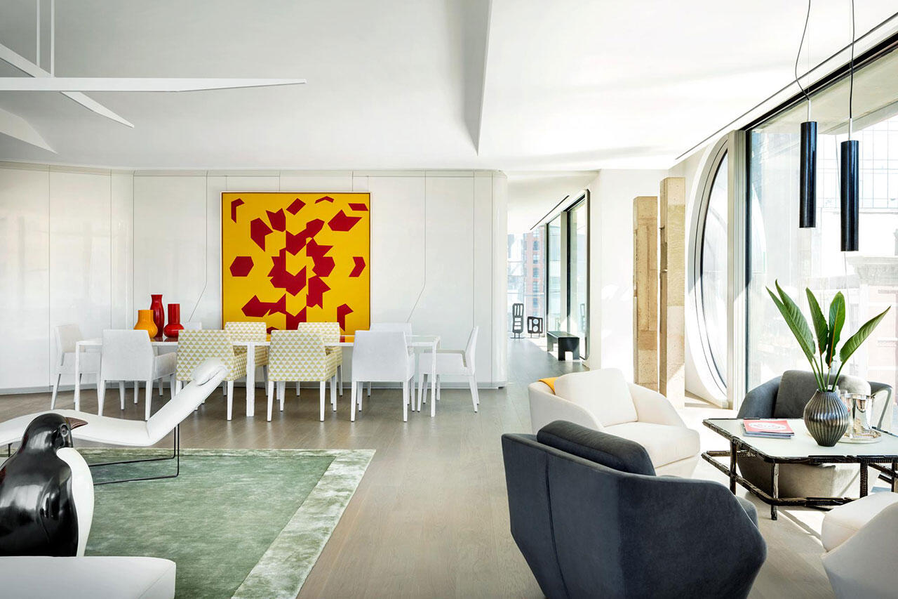 A white room with an Asian patterned separator made of wood